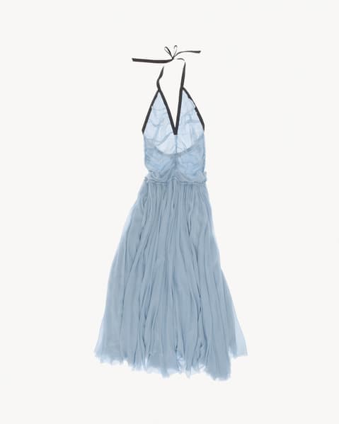 Light blue halter dress with a deep V neckline and black trim, featuring a ruched bodice and flowing, pleated chiffon skirt, displayed flat against a white background.