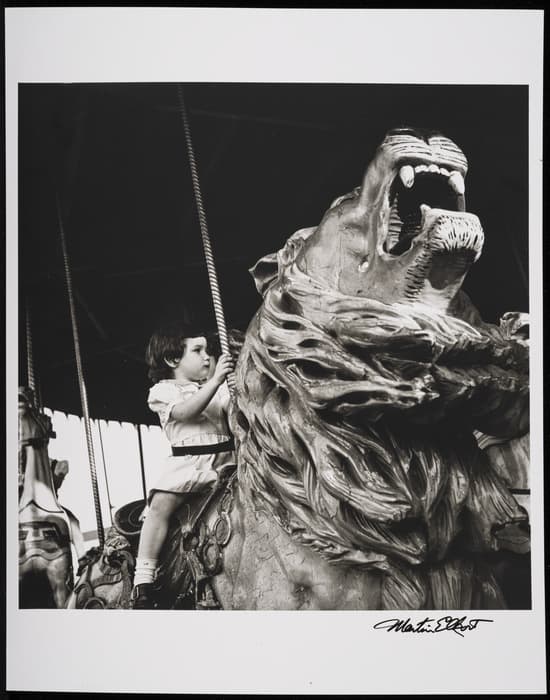 Martin Elkort. Merry Go Round (Riding the Lion)., Coney Island, 1951, printed later. Gelatin silver print. Gift of the Estate of Martin Elkort, 2020-17.