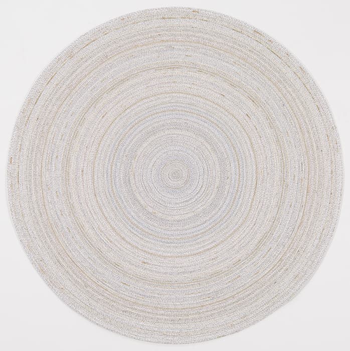 I THE INTERIOR, THE TRACE

Simon Evans, The Voice, 2010
Mixed media on paper
Collection of Alka and Ravin Agrawal

Simon Evans’s drawings, made with delicate, humble materials—paper, pencil, tape, correction fluid—offer a sense of intimacy that is earnest and ironic by turns. Evans uses highly public visual formats such as subway maps and album covers to record emptyings of pockets and closets, amorous confessions, and uncomfortable memories. The Voice recalls a therapist’s injunction to “listen to the voice within.” The mandala shape of the drawing reinforces the idea that it is intended to focus attention; through thousands of mantralike iterations, however, the voice refers only to itself; it leads nowhere.

Benjamin observed that under industrial capitalism the citizen is reduced to the traces she or he leaves in the administrative apparatuses of the state or the marketplace: stamps in a passport, deposits and withdrawals at the bank.

Conversely, as if to offset this diminution, domestic interiors assume great importance, filled with lovingly chosen objects that reflect their owner’s personality. In a public space, the traces that the individual leaves are soon effaced or distorted by the traces left by others. At home, we are surrounded by our own marks, our own memories.