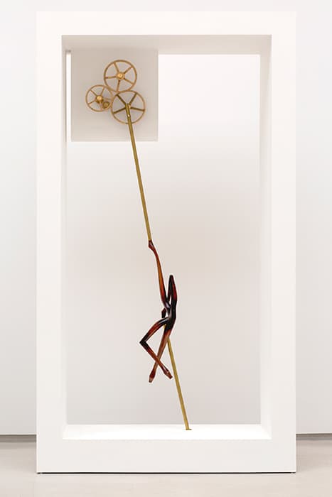 Z THE DOLL, AUTOMATION 

Markus Schinwald, Untitled (Machine I), 2016
Brass, wood and motor
Courtesy of Galerie Thaddaeus Ropac, London, Paris, and Salzburg

The artificial universe of the arcades was populated by artificial beings: in shop windows, dressmakers’ dummies kept company with mechanical figures that revolved on pedestals to the accompaniment of tinkling mechanical music or popped out of closed baskets to surprise children. These uncanny dolls have a menacing aspect, suggesting the encroachment of technology and artifice on nature. Markus Schinwald blends the human with the nonhuman to unnerving effect. This figure, with its anthropomorphic Chippendale-style furniture legs, exudes an unsettling erotic energy.