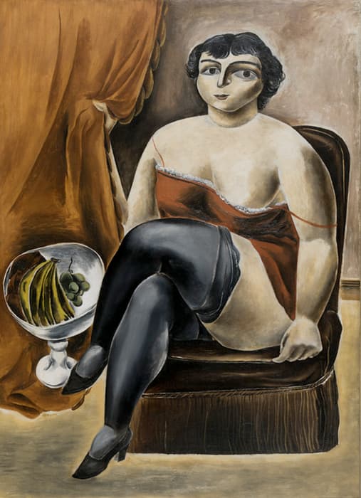 Seated woman in black stockings and a red camisole poses on a brown chair beside a glass bowl of fruit, with draped orange curtains in the background.