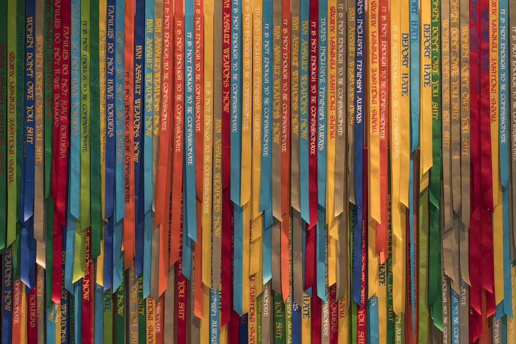 Andrea Bowers, Political Ribbons, 2016. Installation view of the exhibition Take Me (I'm Yours). September 16, 2016 – February 5, 2017. The Jewish Museum, NY. Photo by: David Heald.