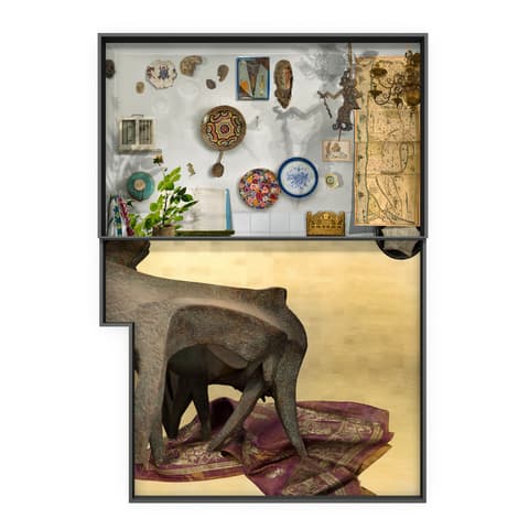 Display case with an eclectic arrangement of cultural artifacts, including ceramics, maps, jewelry, and small sculptures, with a large abstract sculptural piece draped in fabric at the bottom.